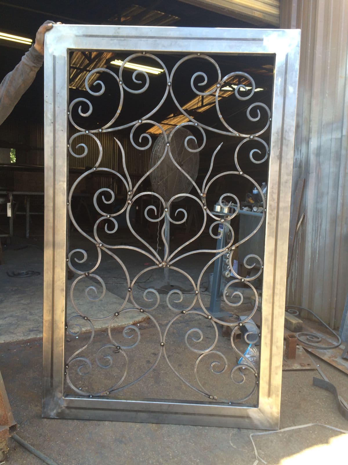Custom ornamental iron panel being fabricated in the shop