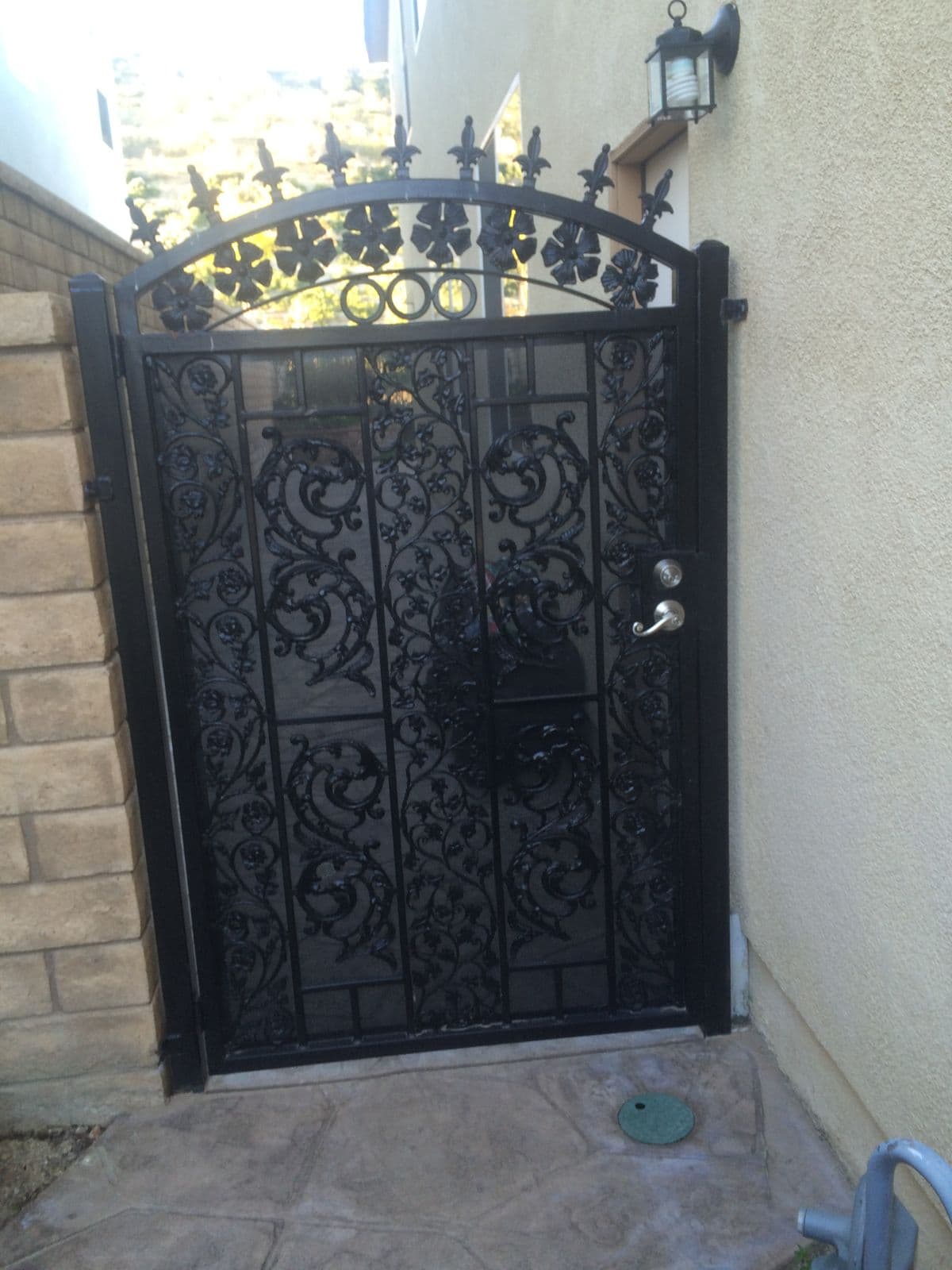 Decorative iron security gate by J.V. General Construction