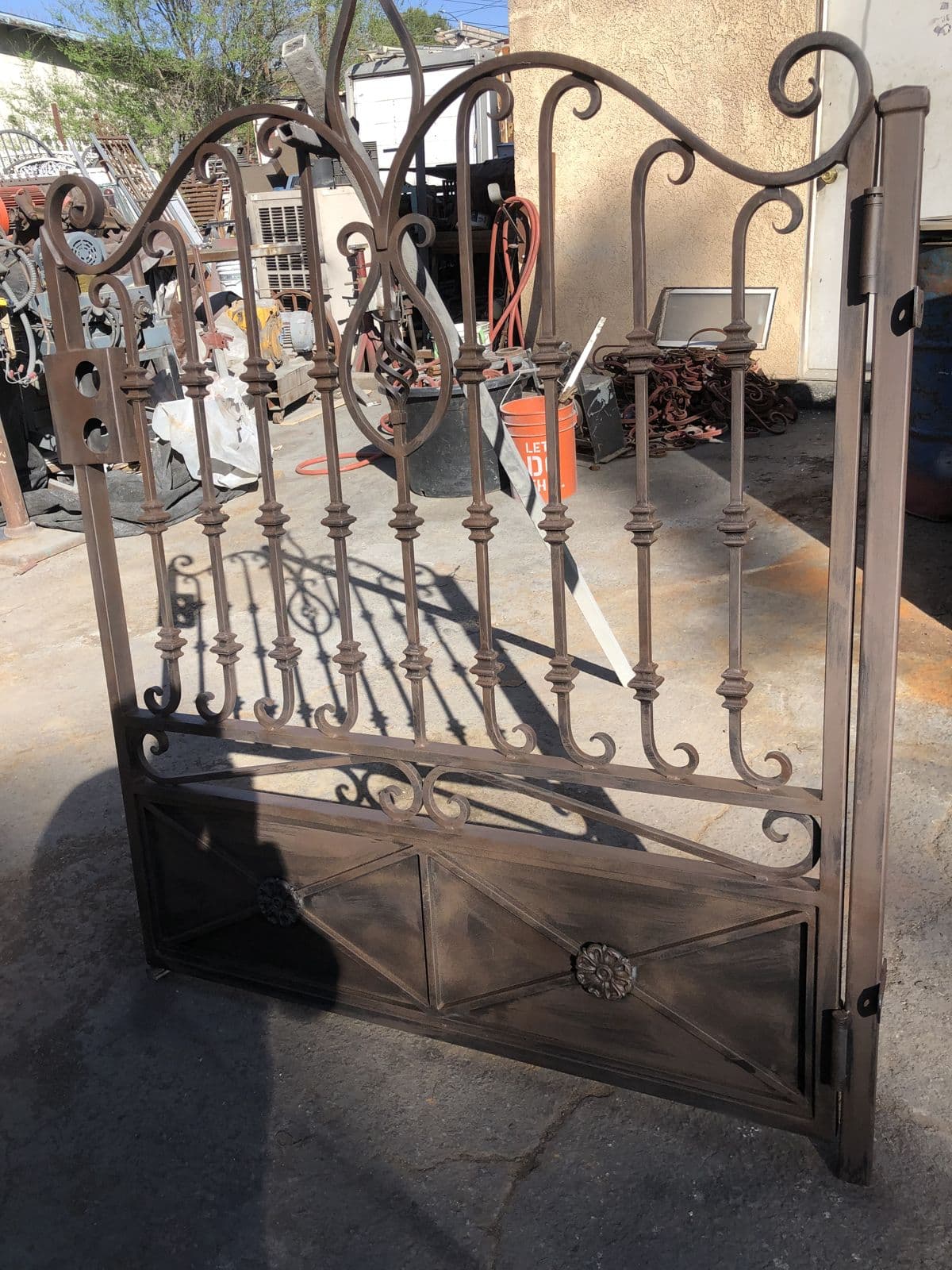 Ornate iron gate mid-fabrication